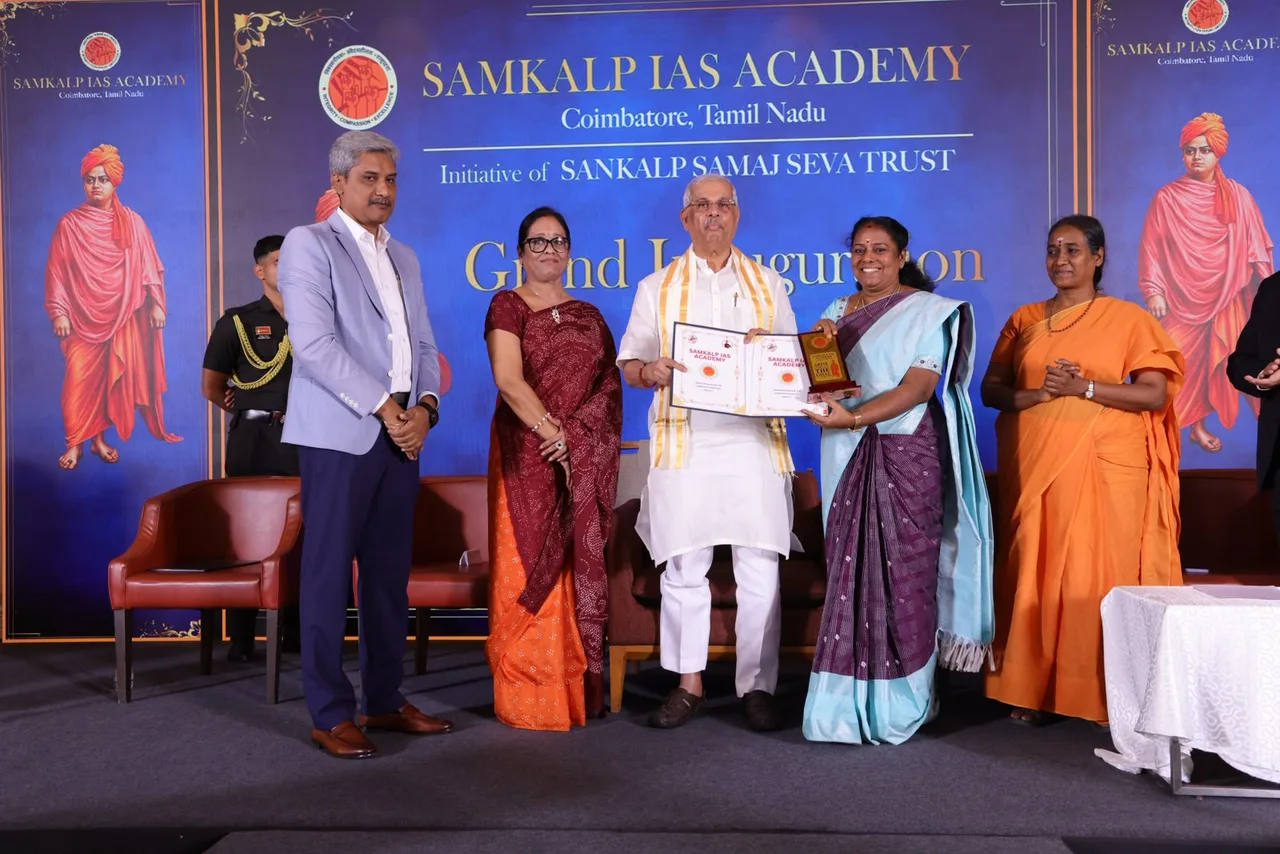 Honourable Dr. Rajendra Vishwanath Arlekar, Governor of Tamil Nadu, handing over the signed MoU between Samkalp IAS Academy and GVG Arts College for Women on the inauguration stage.